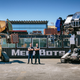 Oehrlein and Cavalcanti standing rather proudly between their old and new robots.